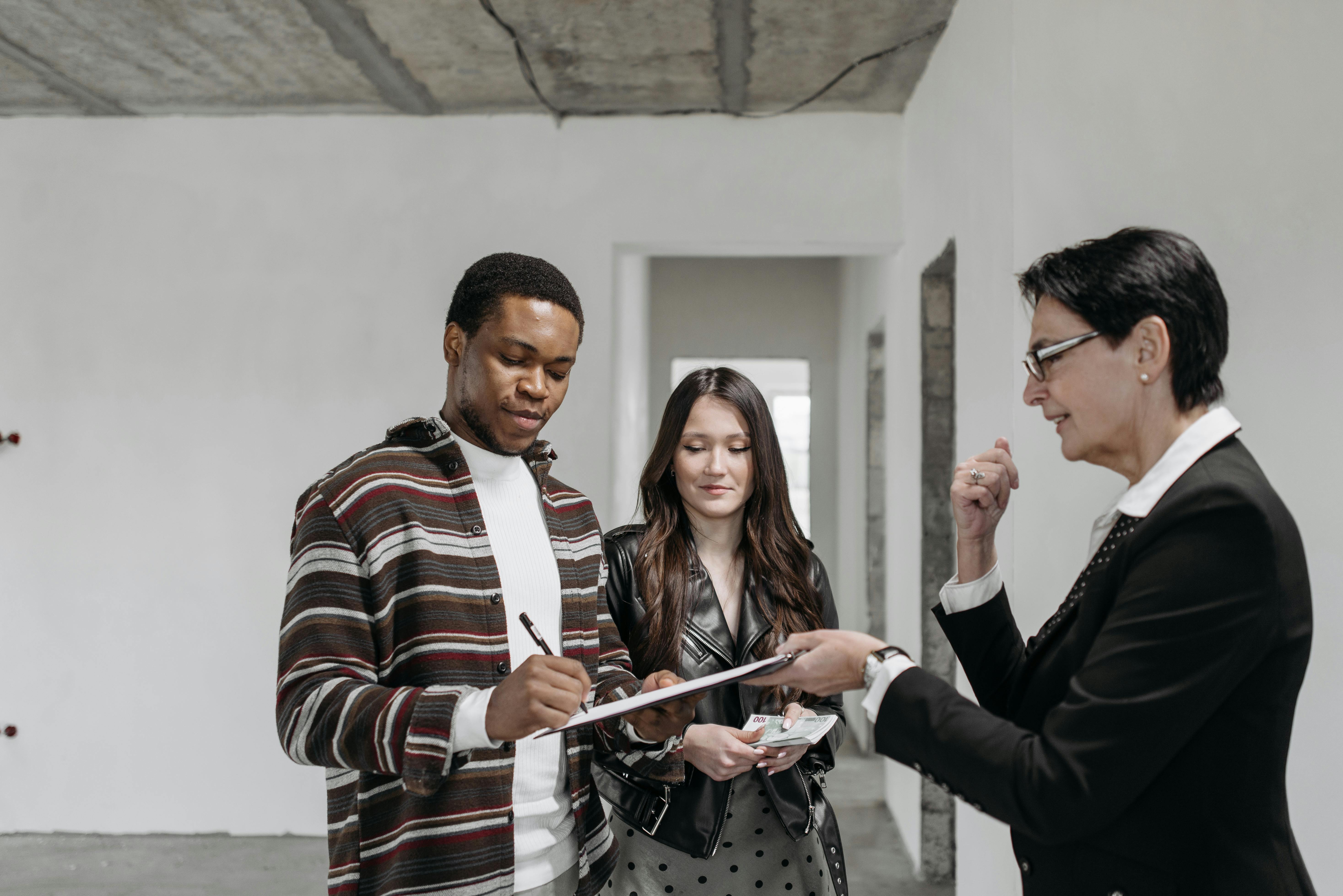 Realtor taking information from a couple