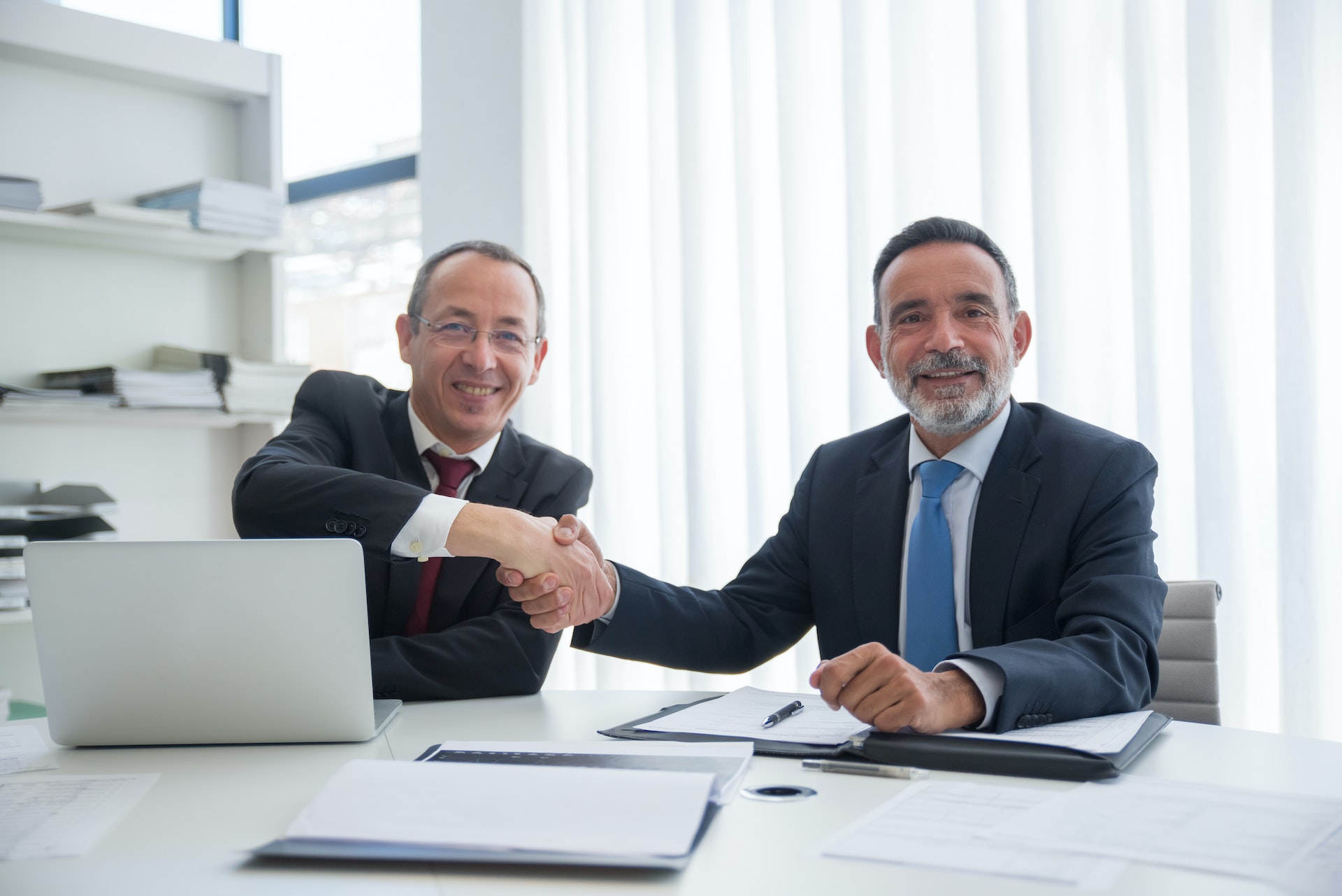 two businessmen shaking hands