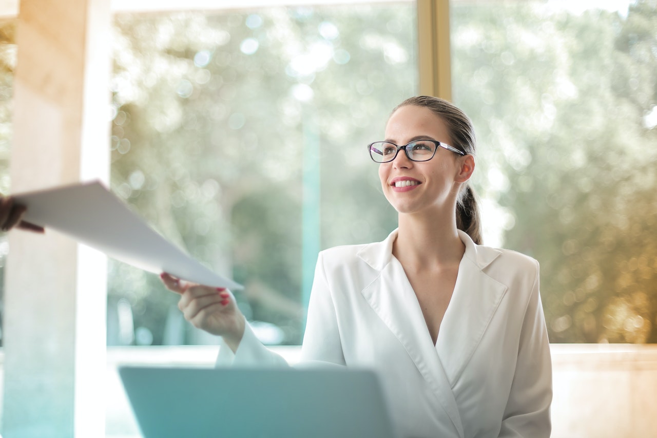 female worker handing a report
